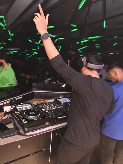 Hyping up the crowd at Hex. It's not just about playing music; it's about interacting with the audience and building energy together.
