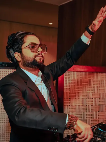 Throw your hands up and celebrate life. A dynamic action shot from a private wedding event.