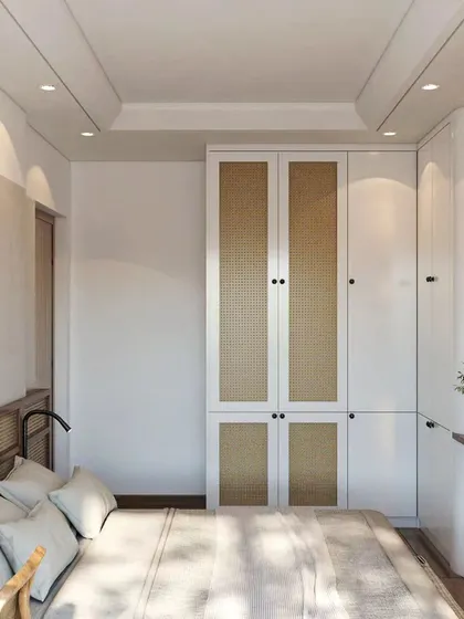 A 3D render of a bedroom with a Japandi aesthetic. The design features a bed with a cane headboard and a matching cane-shutter wardrobe, creating a natural and calming vibe.