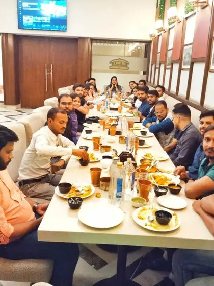 Sharing a meal with a group of peers. Collaboration and open discussion are key to professional growth and developing innovative strategies.