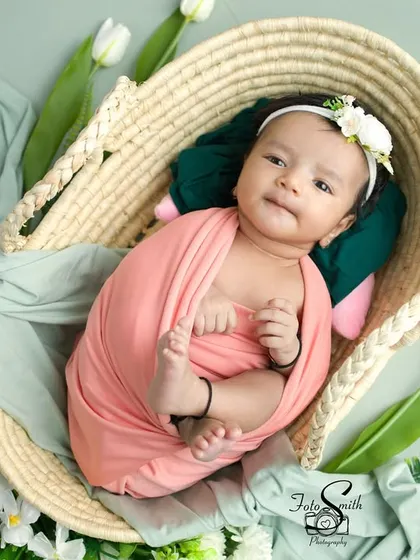 This little one looks so cozy in this basket, peeking out with a sweet expression. The combination of textures and soft colors is lovely.