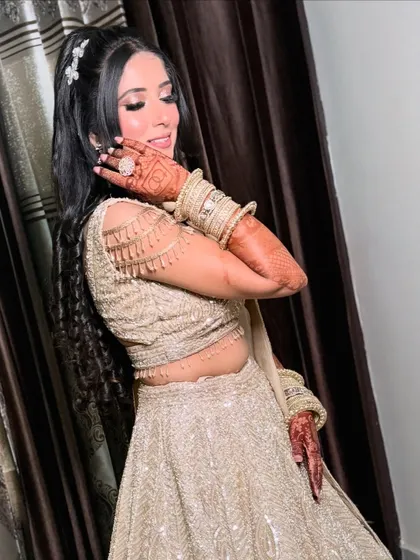 The bride's joy is infectious in this shot. Her makeup enhances her happiness, making her glow from within.