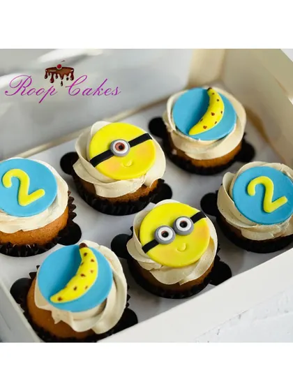These fun Minion cupcakes were for a 2nd birthday celebration. I created handmade fondant toppers featuring the lovable Minions, their favorite bananas, and the birthday number.