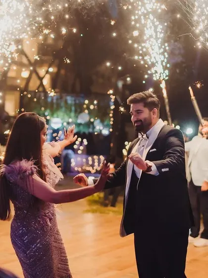 A grand entrance for the couple, complete with cold pyro sparklers, making for a dramatic and celebratory start to their evening festivities.