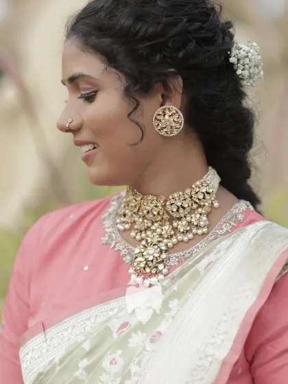 Jahnavi looking effortlessly elegant in her pastel pink silk blouse with delicate floral designs.