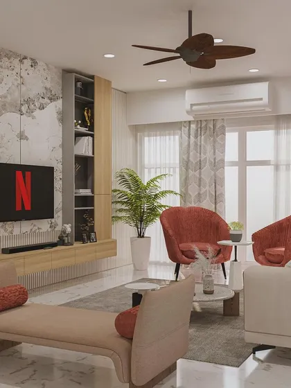 This living room features a textured wall behind the TV, comfortable red armchairs, and a sleek daybed, creating a multi-functional and stylish space.