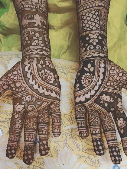 I love incorporating symbolic motifs like the elephant in this bridal design, which represents good luck and prosperity. The patterns are a mix of bold shading and delicate line work.