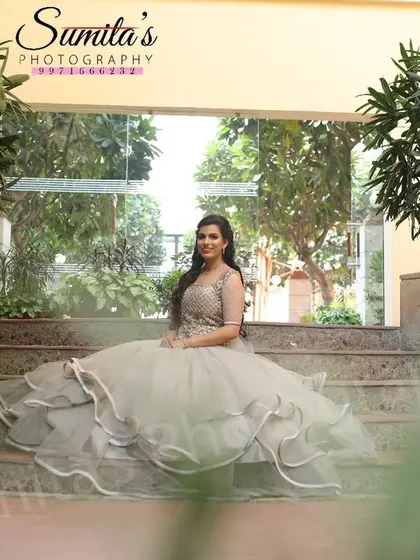 A princess moment. This bride, seated on the stairs in her voluminous gown, looks like she's stepped right out of a fairytale.