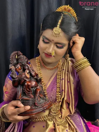 Another angle of the Gowri Ganesha festive look, showing the secure and elegant traditional updo. We teach our students how to create durable hairstyles that last throughout long events.