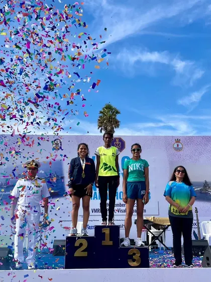 Standing on the podium at the Vizag Navy Marathon after a 42.2km race. Competing against a strong field and securing a top-three finish is what my race strategy coaching prepares you for.