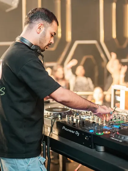 A side view of me at the console, with the crowd visible in the background.