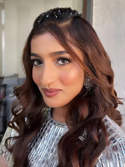 A direct look, showing how the crystal eye makeup catches the light. This is a perfect example of a creative and glamorous cocktail look.