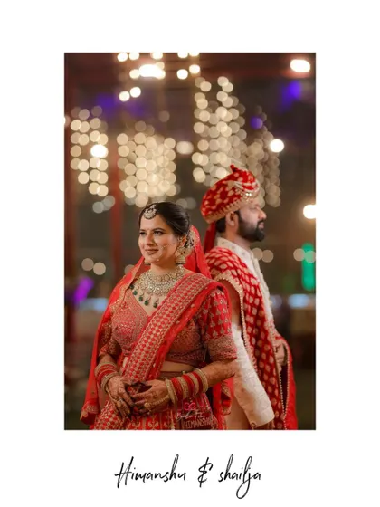 A classic back-to-back portrait of the bride and groom against a backdrop of beautiful bokeh lights.