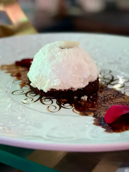 A dessert that promises a tropical escape. Our Coconut Nutella Dome features a rich Nutella centre encased in a light coconut mousse, all presented on a bed of chocolate crumble.