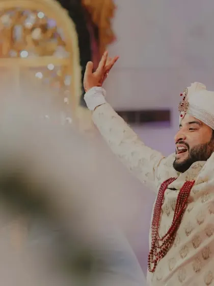 A groom's solo dance moment, full of joy and excitement. Capturing these expressions of happiness is key to telling the full story of the celebration.