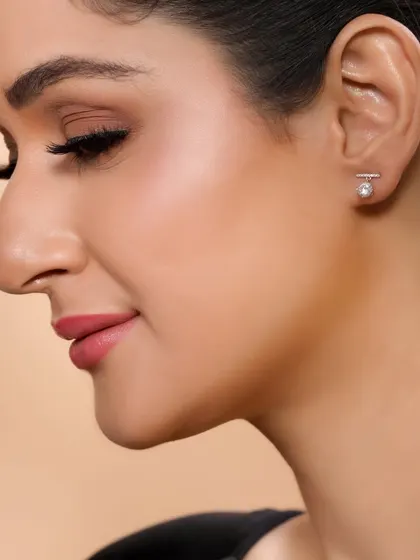 A profile shot highlighting a simple, elegant stud earring, demonstrating our ability to capture subtle and fine jewellery pieces.
