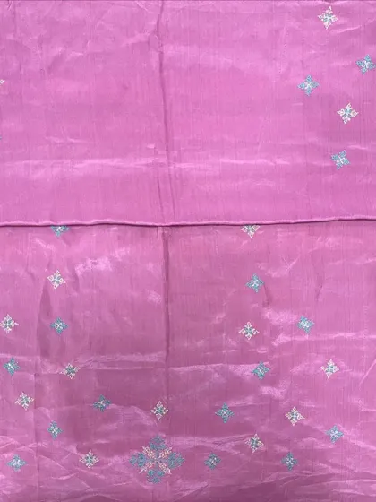 A lovely pink silk saree with delicate, scattered Kasuti butis. This is a great example of how embroidery can add a subtle, elegant touch without overwhelming the fabric.