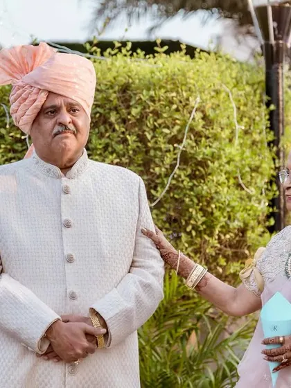 The father of the bride's emotional reaction as he watches his daughter during her wedding ceremony. A truly priceless moment.