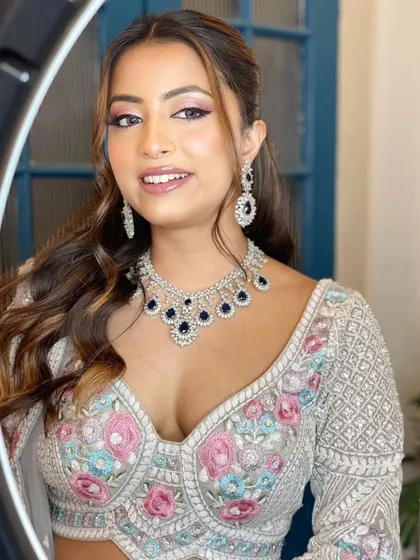 A modern, fashion-forward look featuring a pearl-encrusted gown. The simple diamond drop earrings are the perfect accessory for this statement outfit.