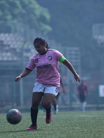 Our team captain on the ball, leading by example with composure and skill.