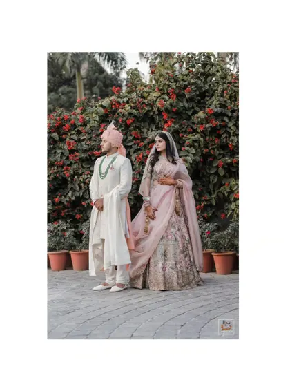 A classic, full-length portrait of the couple at their Jaipur wedding.