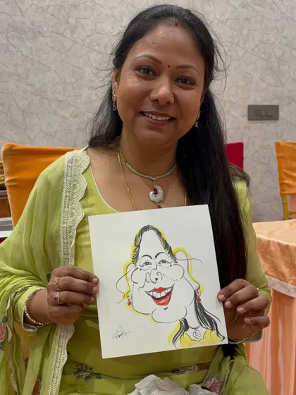 Her graceful smile is reflected in her caricature. It's all about capturing the essence of a person.