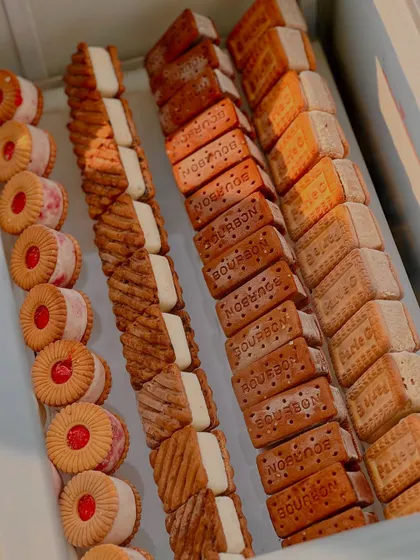 A full tray of nostalgic ice cream sandwiches, featuring a variety of classic Indian biscuits like Parle-G, Bourbon, and Jim Jam.