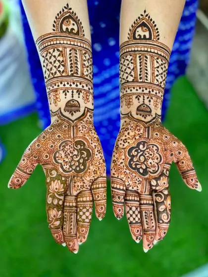 Another shot of the wedding mehendi against a vibrant green background.