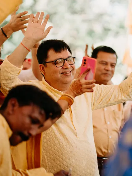 A guest captures the happy moments on his phone, showing how everyone is involved in celebrating the day.