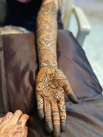 A close-up of the intricate work on the back of the hand for this bridal set.