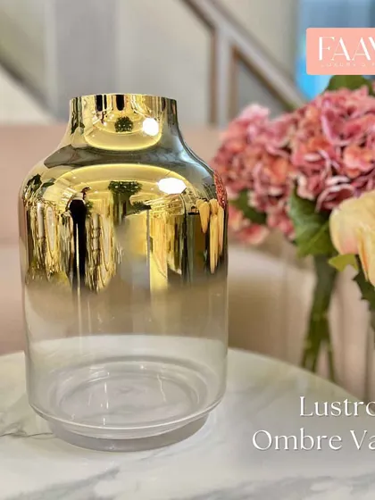 Our Lustrous Ombre Vase is the perfect vessel for our artificial flowers. The gold-to-clear gradient adds a touch of glamour and complements any floral arrangement.