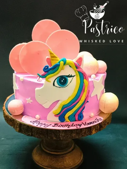 A magical unicorn cake with a colourful mane and sparkling stars, designed to make a birthday wish come true.