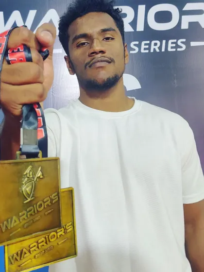 A close up of the two hard earned gold medals from the Warrior's Dream Series in grappling and MMA.