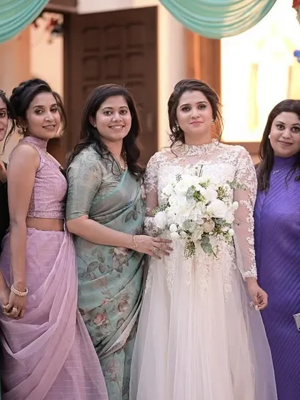 The bride with her bridesmaids. I also offer party makeup for the bridal party to ensure everyone looks cohesive and beautiful.