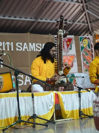 A wider view of our performance in Pune, featuring a wonderful ensemble of musicians on sitar, guitar, and keyboard, creating a rich musical tapestry.