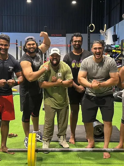 "If you want to test your strength, come and work out with us." A photo with my team, a group of strong individuals who push each other every day.