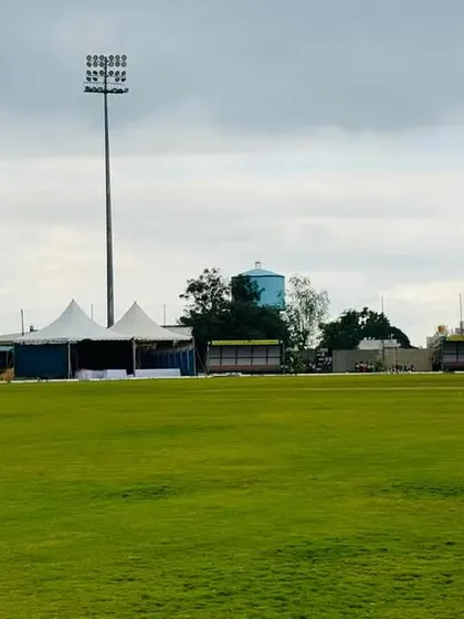 The combination of our green field, event tents, and floodlight towers under an overcast sky, ready for any weather.