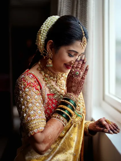 An emotional and beautiful moment. The rich detail of the zardosi work on the blouse is visible even in this candid shot.