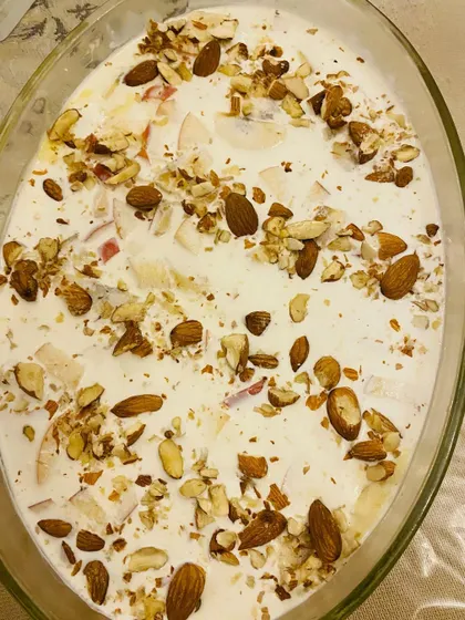 This is my Arabian Pudding, a creamy and delicious dessert topped with a generous amount of crunchy almonds and nuts.
