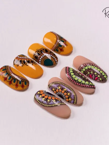 This shot highlights the beautiful symmetry and detail of my hand-painted mandala nails.