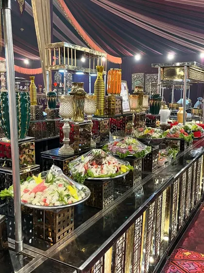 Beyond sweets, my cold stations include a variety of fresh and vibrant salads. This counter showcases several salad options presented in elegant bowls, offering a light and healthy choice for guests.