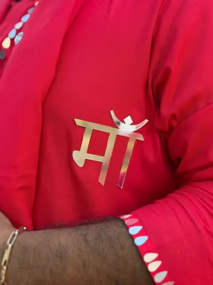 A close-up of the 'Maa' brooch on my outfit. My mother is my biggest inspiration, and I carry her blessings with me, especially during the most emotional and important wedding rituals.