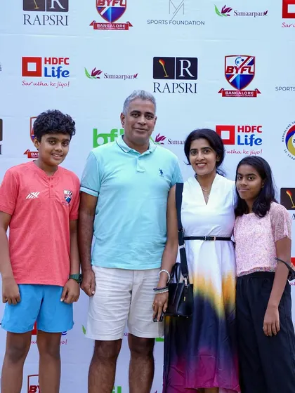 A family posing for a photo at our 15th Year Celebration. We are proud to have such supportive families in our community.