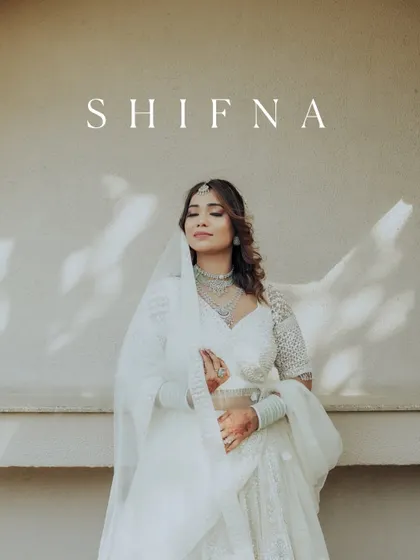 A serene and elegant portrait of the bride Shifna, dressed in a beautiful white outfit for her Nikah ceremony.