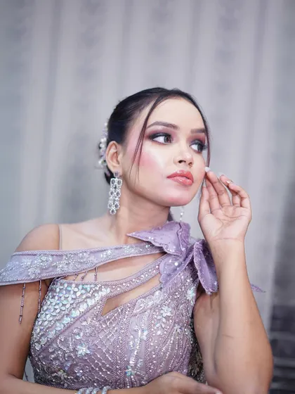 Another detailed shot of the unique neckline and shoulder embellishment of the lilac gown.