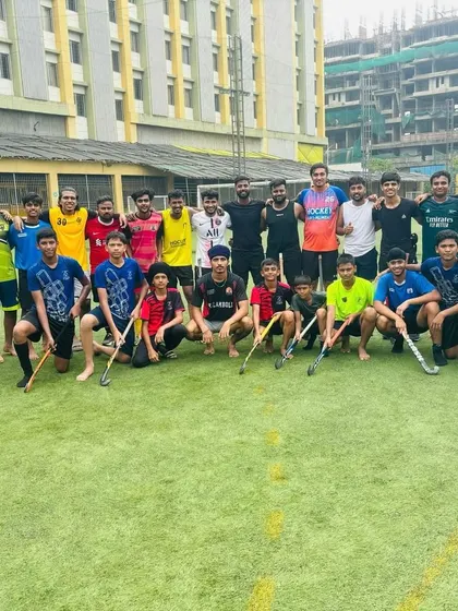 A large group photo of our junior and senior players after a Sunday friendly. These games bridge the gap between different age groups, creating a single, unified club.