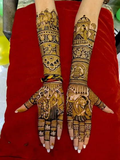 A beautiful depiction of a wedding, with a doli scene, a couple's portrait, and other ceremonial elements filling the arms.