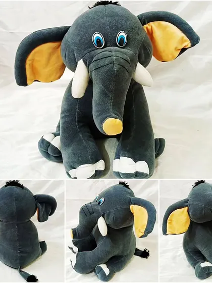A handmade soft toy elephant created in our toy making workshop. We teach you how to design, cut, and sew your very own plush creations.