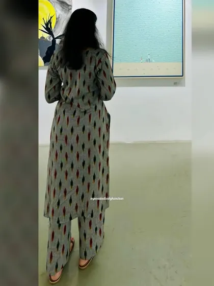 A candid shot of our grey Ikat kurta pant set, looking effortlessly elegant in an art gallery. It’s proof that comfort and style can go hand in hand.