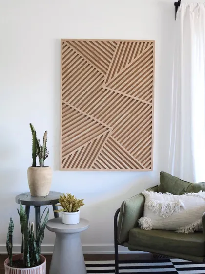 This slat wood art piece is perfect for adding texture to a minimalist space. The clean lines and natural wood finish are both modern and timeless.